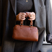 Styled Fit Perspective of Dalford Full-Grain Leather Handbag レディース on Model - Natural Daylight Drape