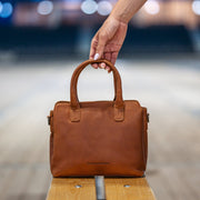 Styled Fit Perspective of Hermosa Full-Grain Leather Handbag レディース on Model - Natural Daylight Drape