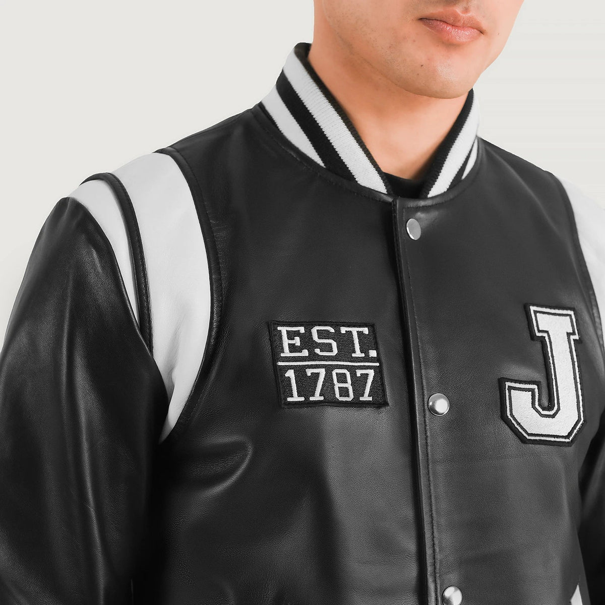Close-Up Detail of Varsity &amp; Snap Button Hardware on Liberte New Jersey ブラック Leather Varsity レザージャケット メンズ