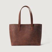 
The Bianca Vintage Distressed Brown Leather Tote Bag For Women - マチの奥行きと拡張容量を示す立体的なサイドプロファイル